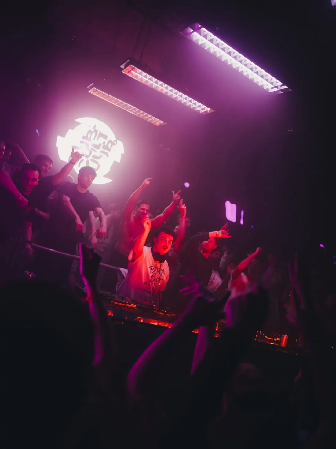Hands up around the DJ booth